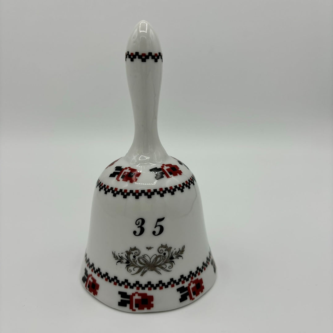 Ceramic bell in white, red and black