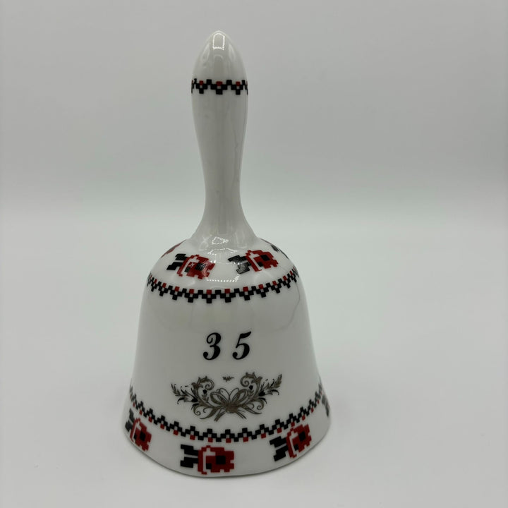 Ceramic bell in white, red and black