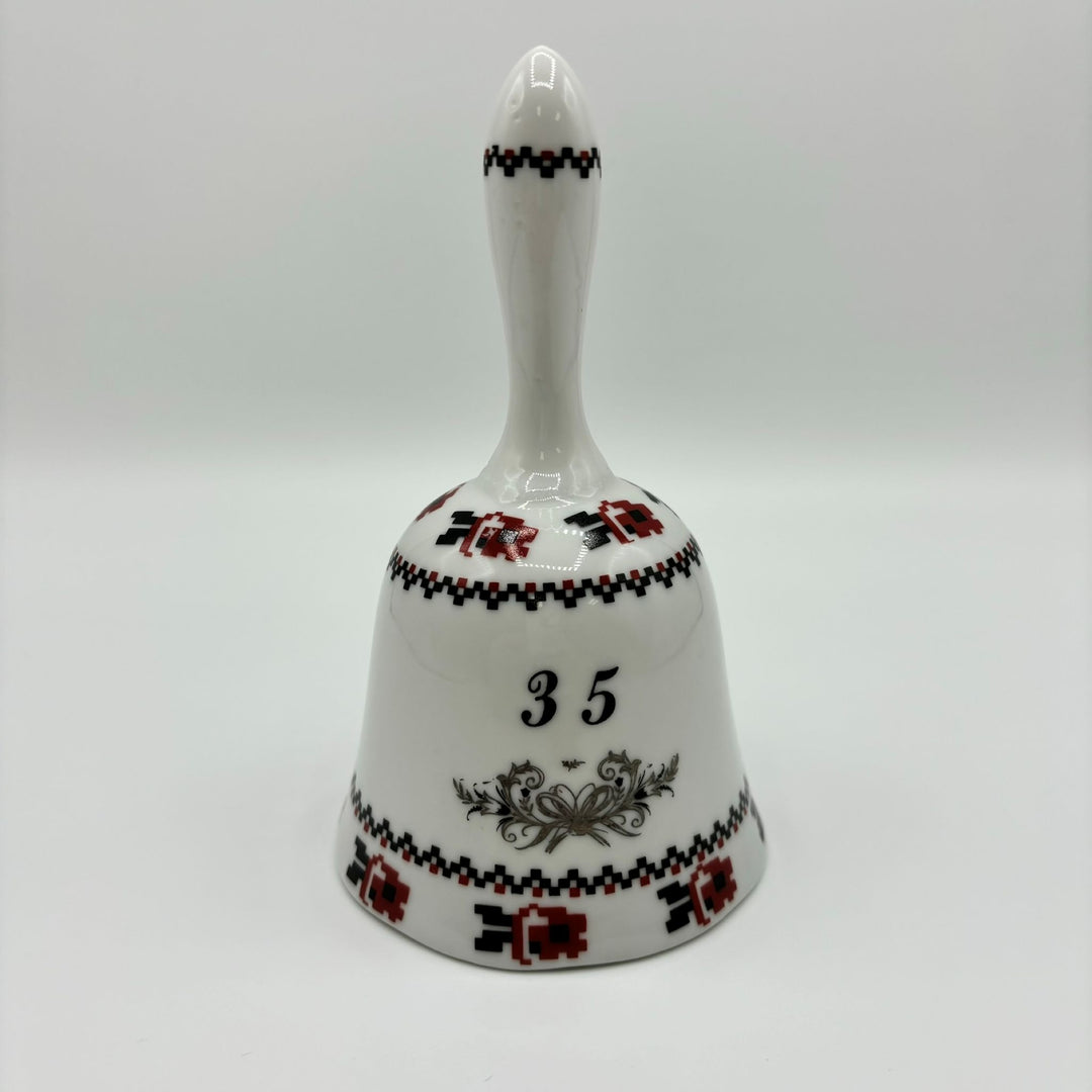 Ceramic bell in white, red and black