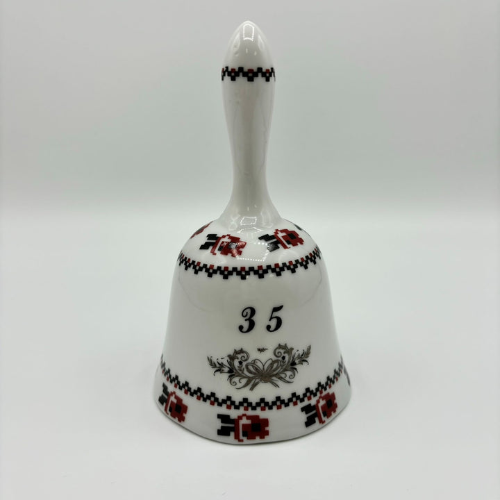 Ceramic bell in white, red and black